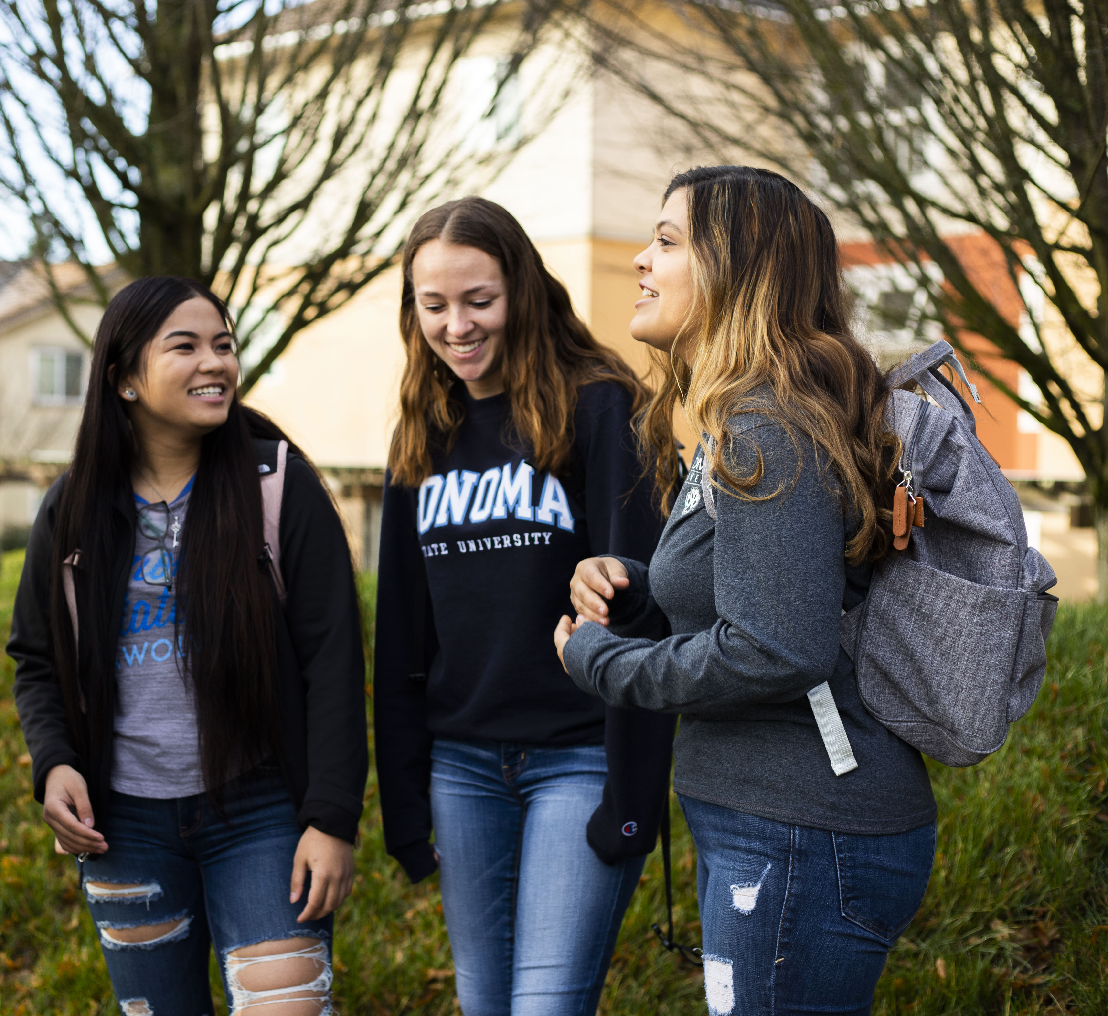 Three Students Talking in SSU Logo
