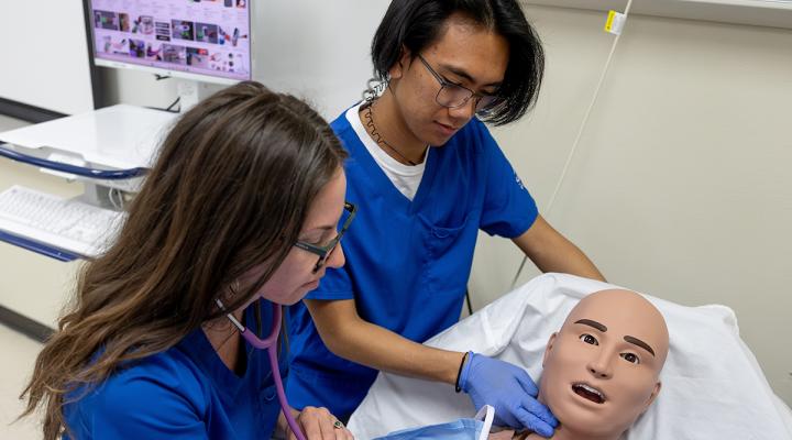 Nursing student practicing skills