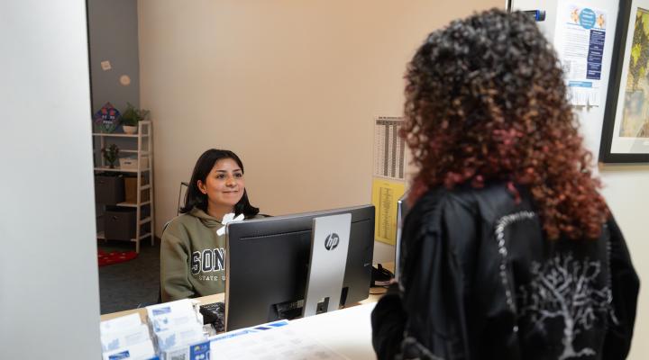 student checking in at the academic support center