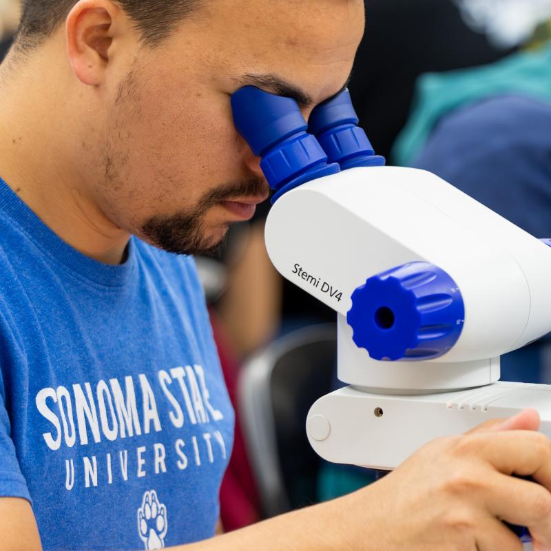 Student on a microscope