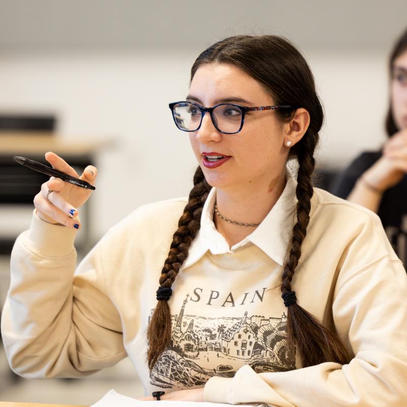 Student wearing a spain sweatshirt in a classroom