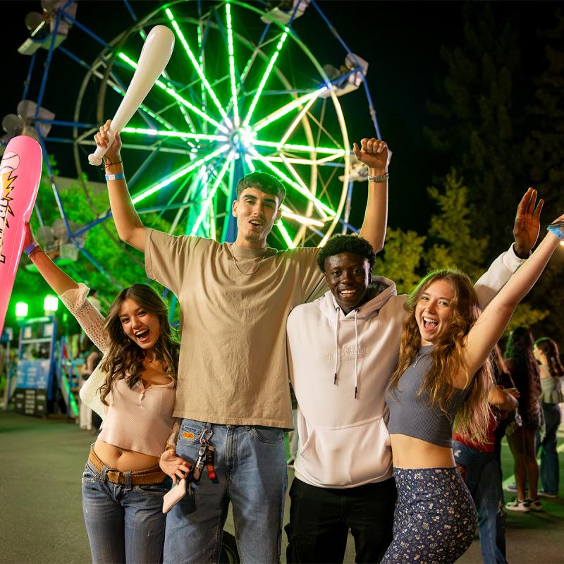 four students having fun at big nite