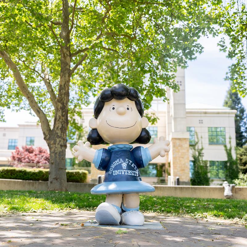 Lucy wearing an ssu outfit outside Schulz library