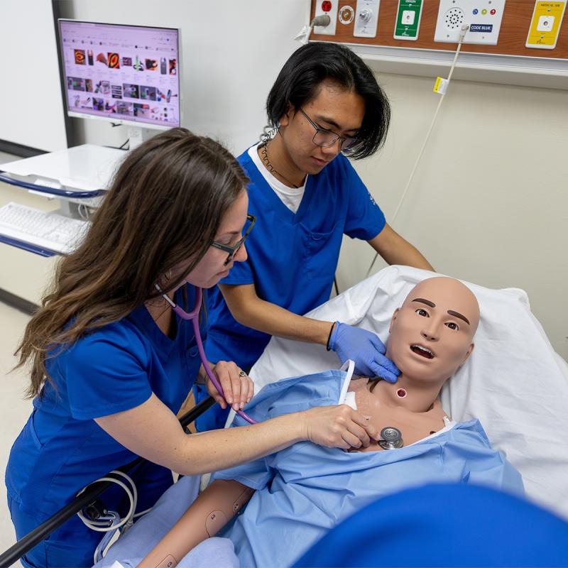 Nursing student practicing skills