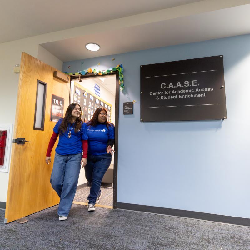 Two students walking out of CASSE office