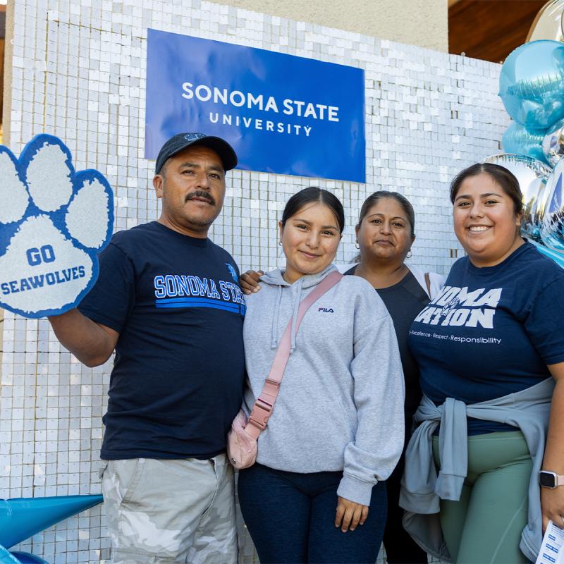 students and her family taking a photo at move-in day