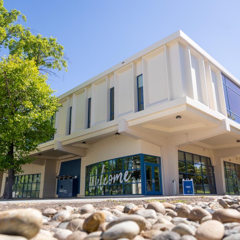Exterior of Salazar building with large signage on building that says Welcome