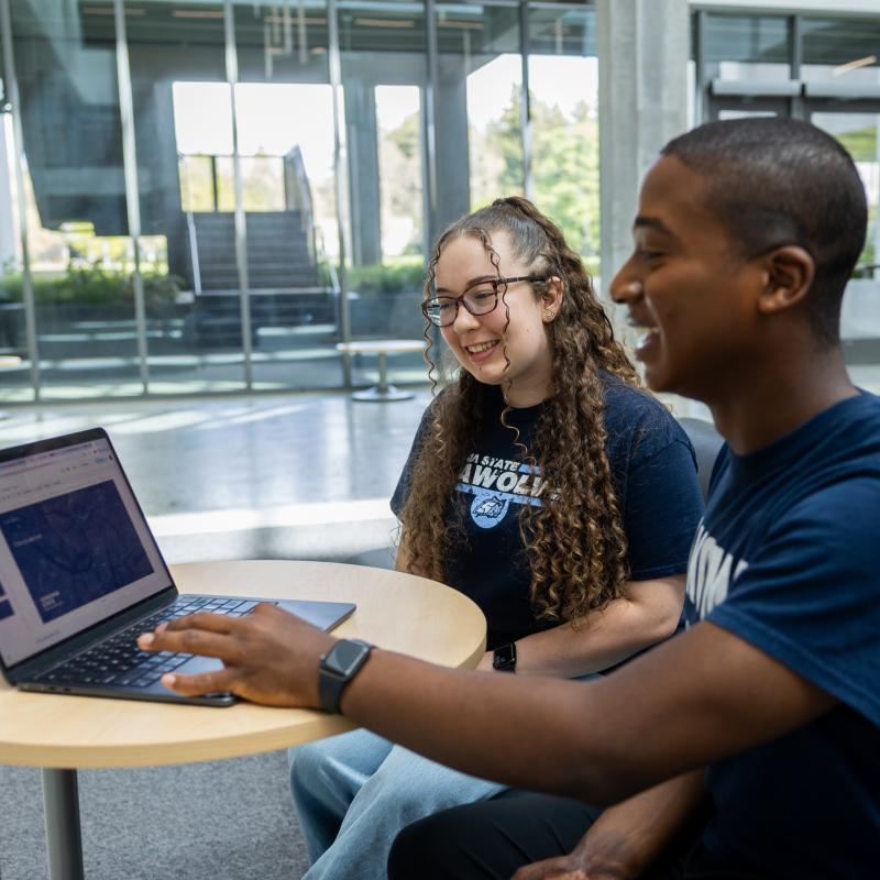 2 students looking at CSU resources
