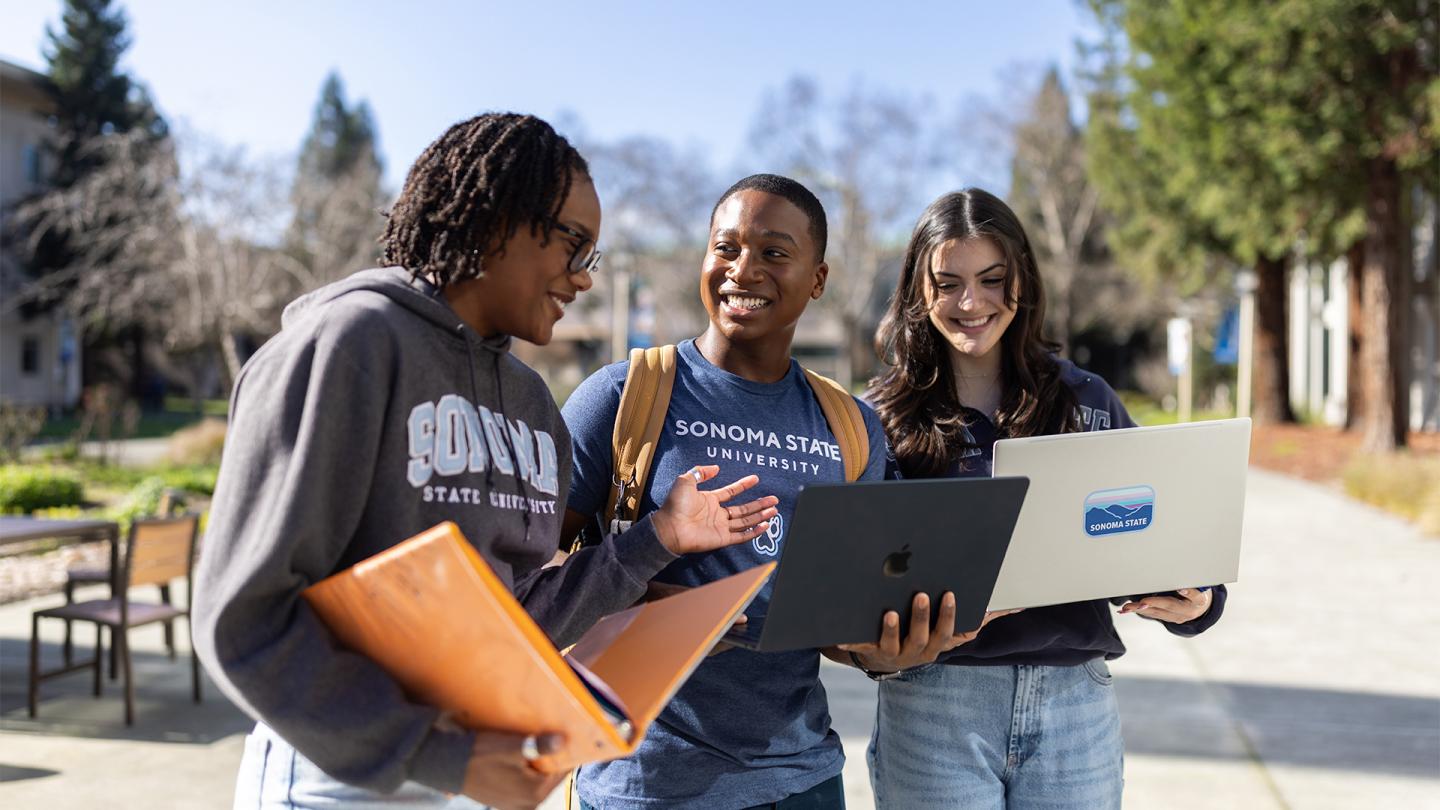Students looking at their admissions email