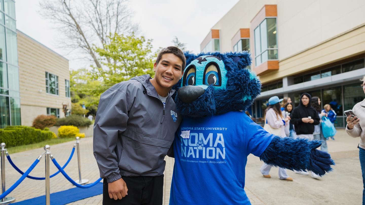 student and lobo taking a photo