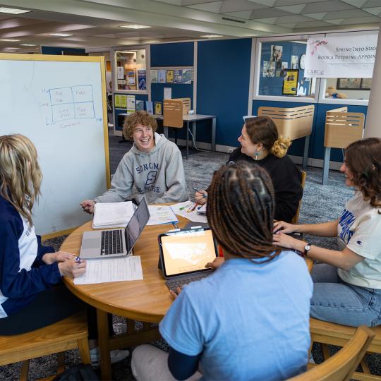 students using the library's white board