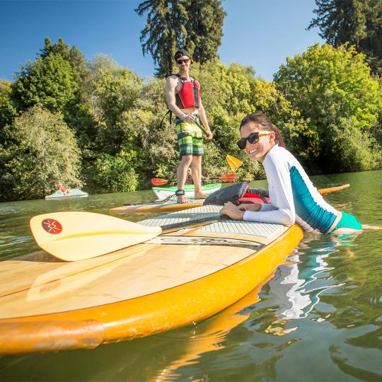 students paddle boarding at the russian river