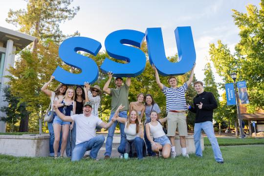Group of students holding up SSU large letters